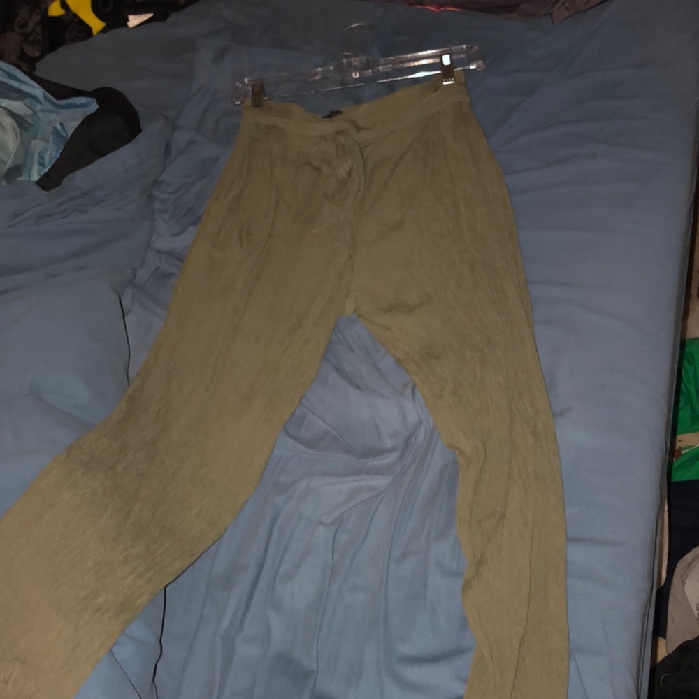 Green, loose fabric pants